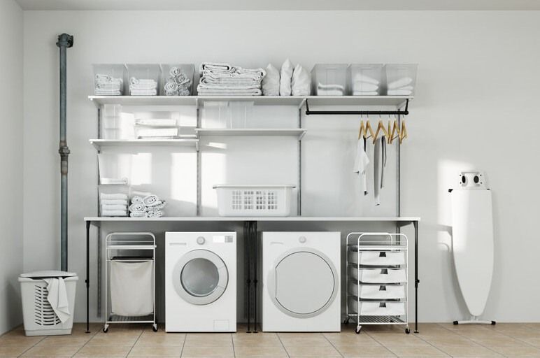 Laundry area iwth overhead shelving for basktes, towels and ironing board