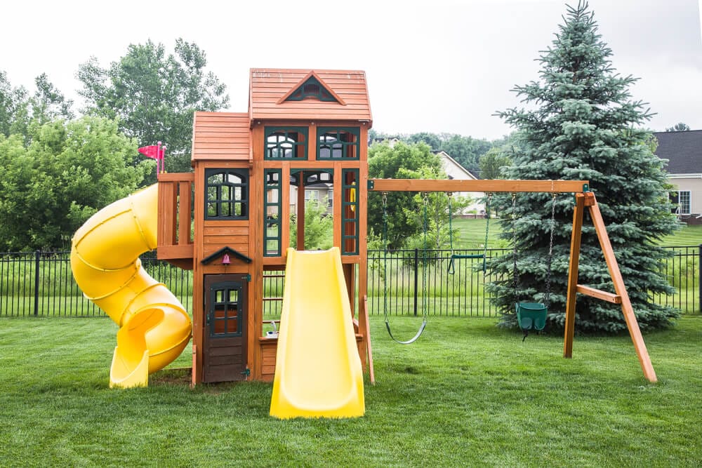 wooden play structure and swing-set