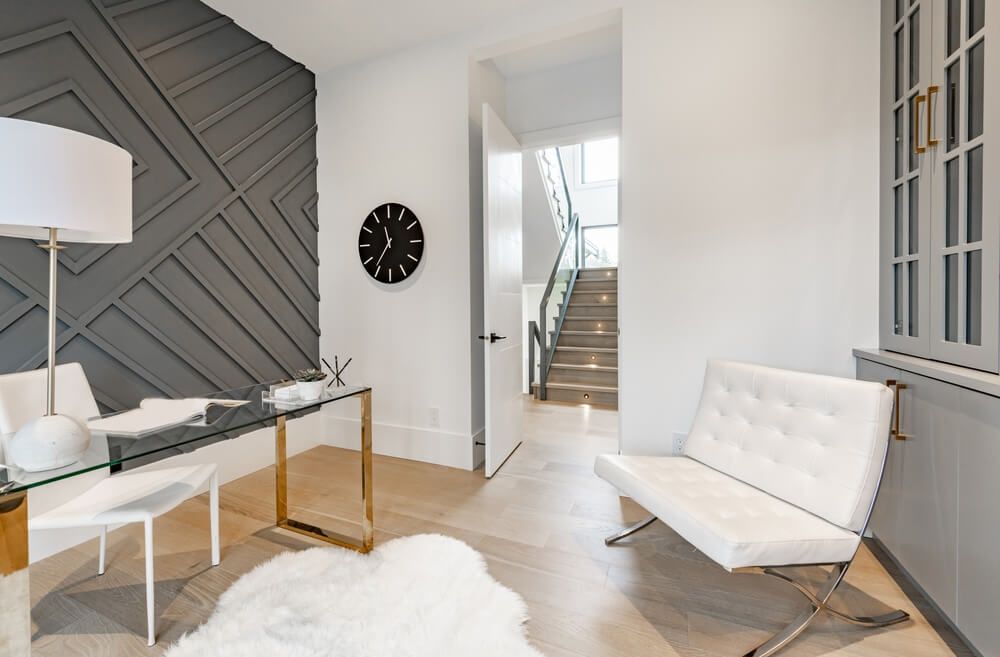 Stylish office with gray walls and shaggy rug