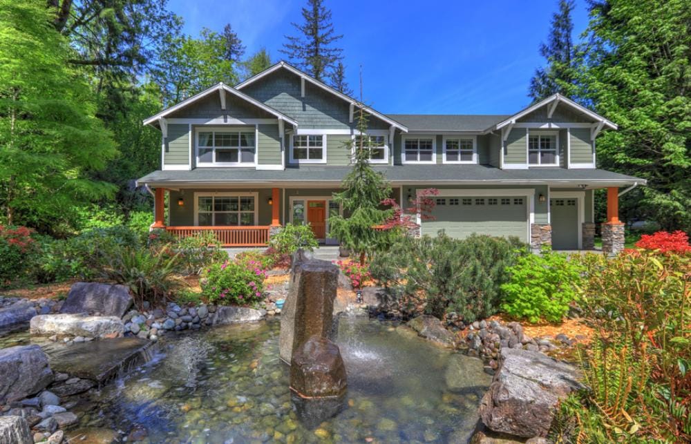  reflecting pool of water in front of a home